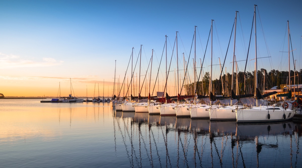 Marina with sailboats at sunset
